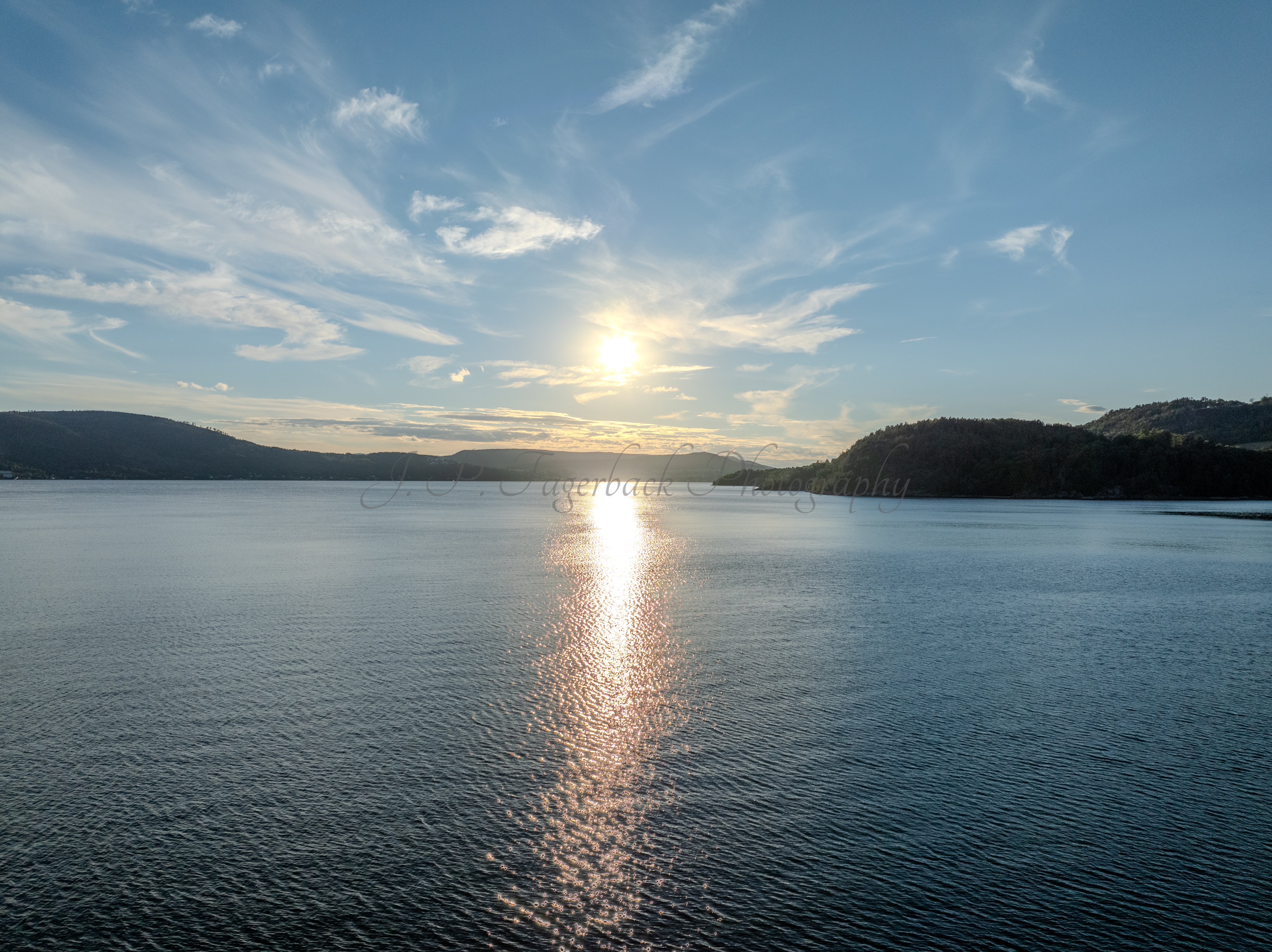 Buildings seen from a body of water during sunset