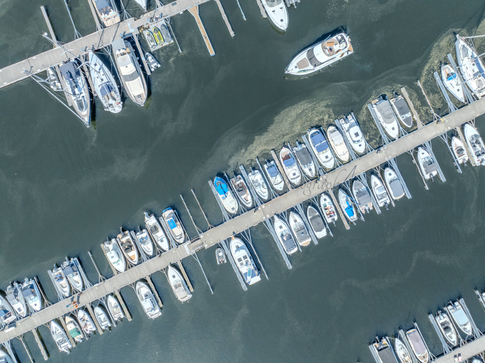 Buildings seen from a body of water with a blue sky