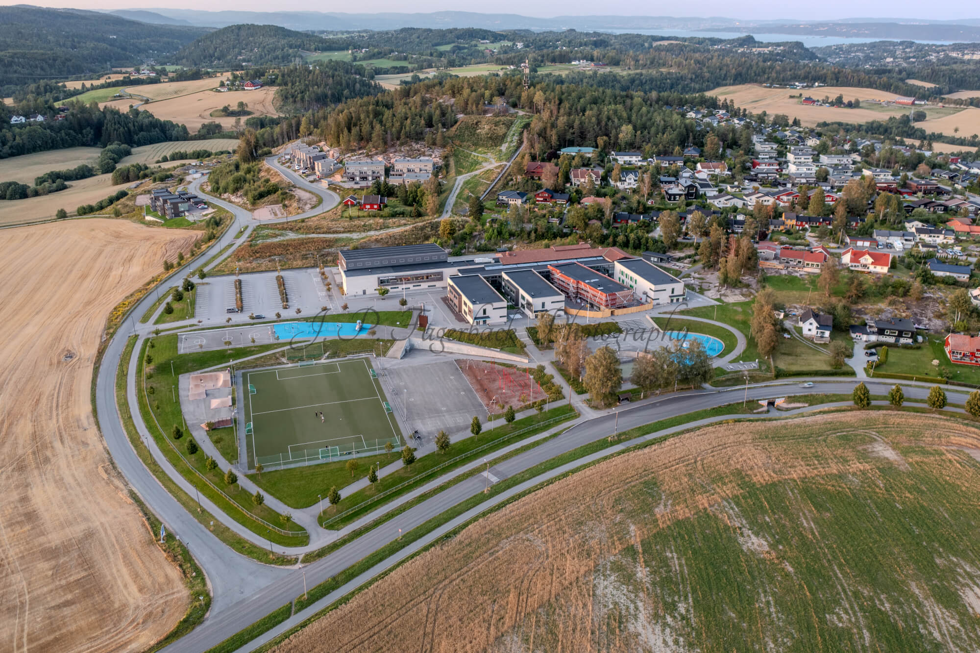 school with playgrounds with fiields and other buildings around